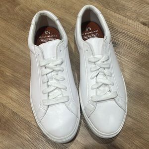 Solid white sneakers